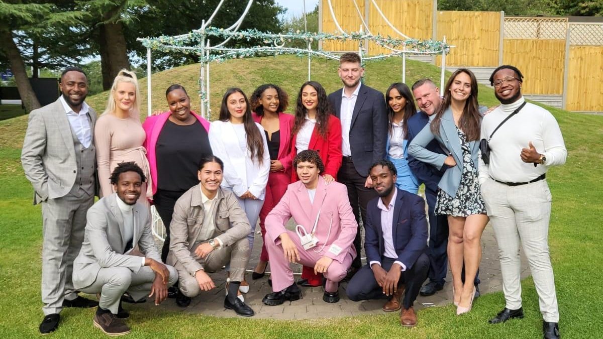 Team group photo outdoors on grass