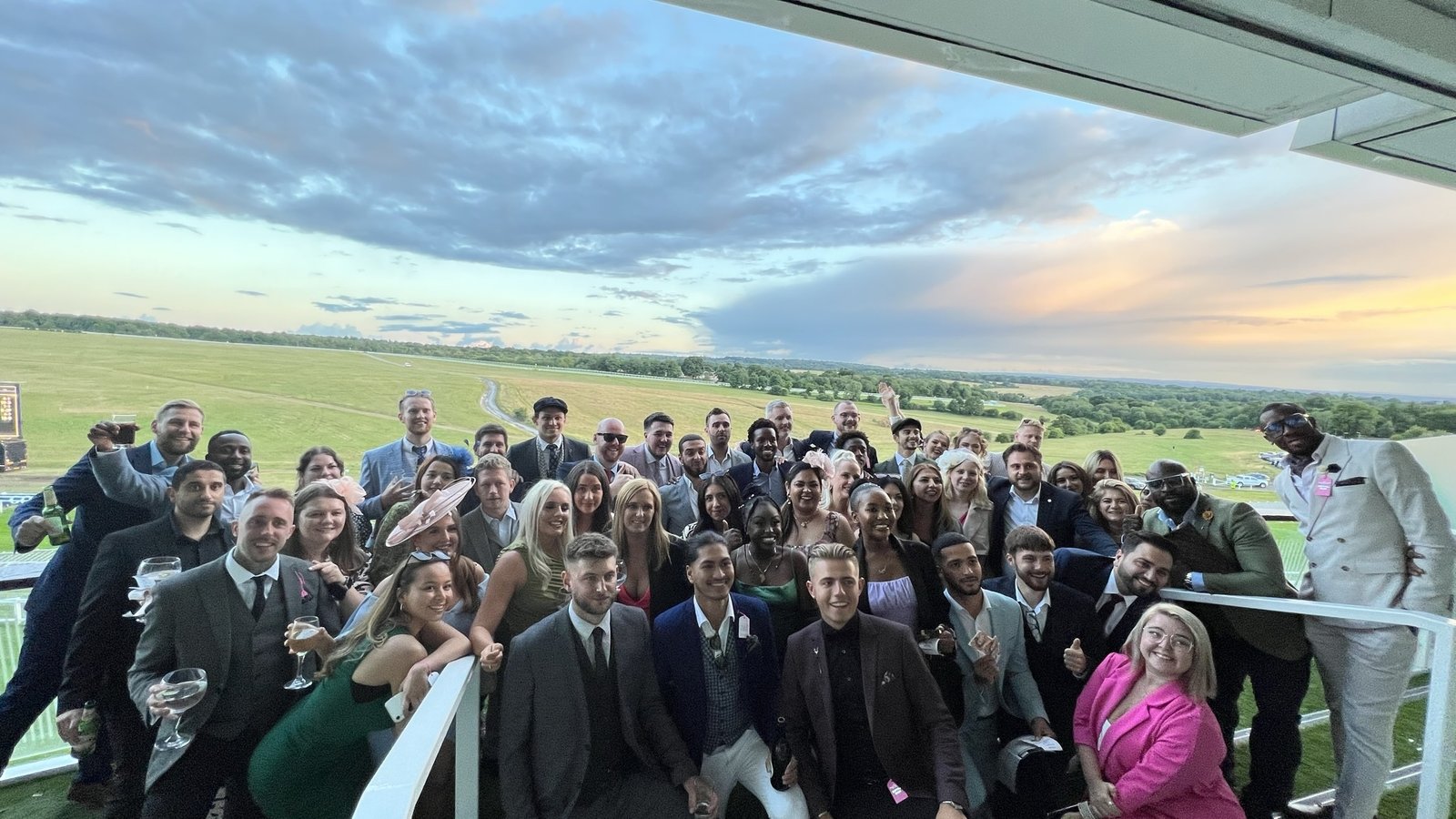 Team gathering at racecourse terrace