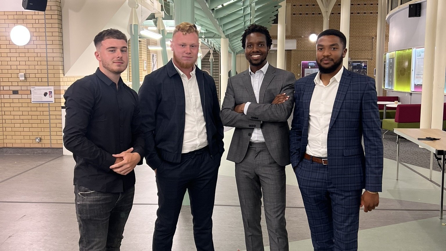 Team members posing indoors